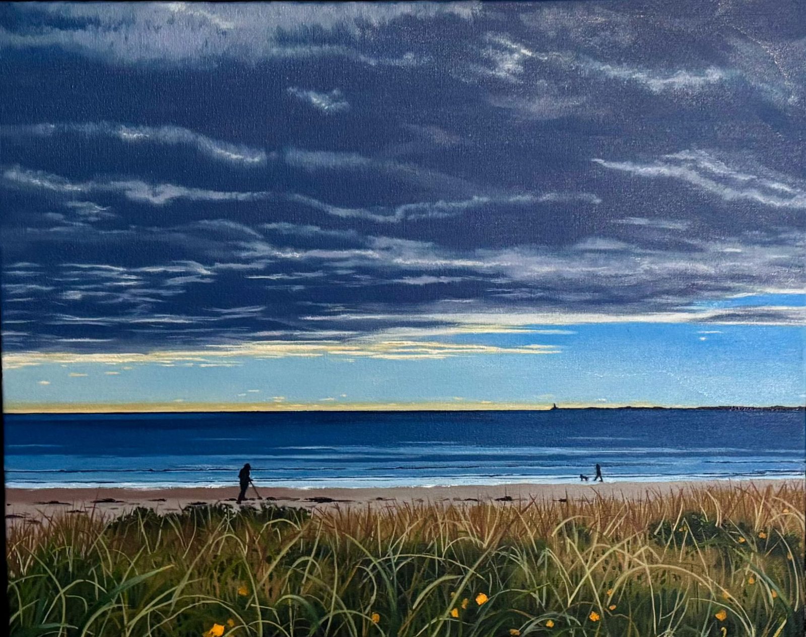 A Maine beach at dusk beneath a vast brooding sky, a low band of gold breaking along the horizon, dune grass in the foreground and lone figures walking the shore